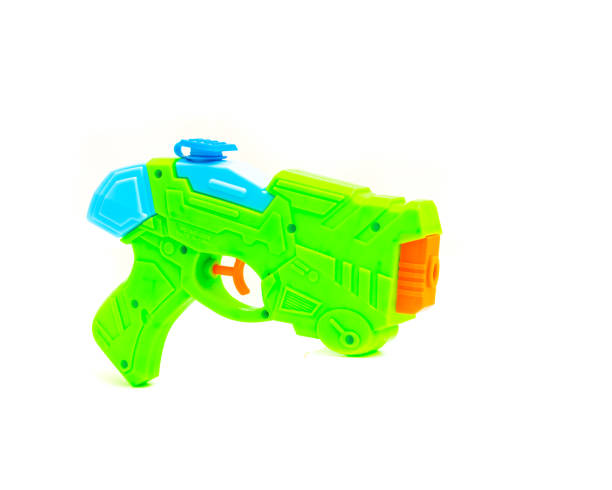 istock Close-up water gun pool beach toy isolated on white 973011472