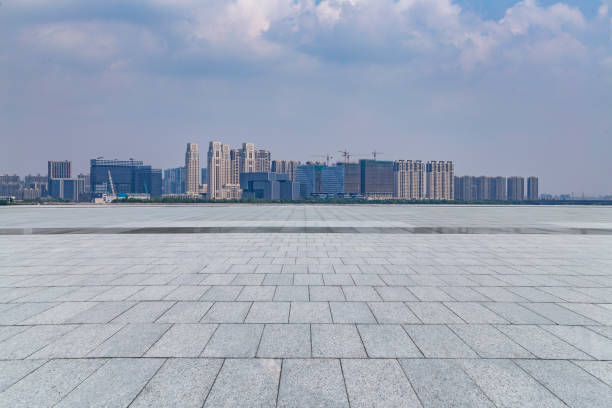 istock Panoramic skyline and modern business office buildings with empty road,empty concrete square floor 973011798