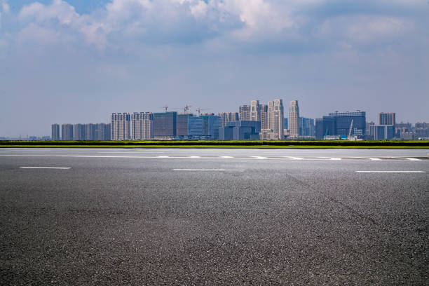 istock Panoramic skyline and modern business office buildings with empty road,empty concrete square floor 973011838