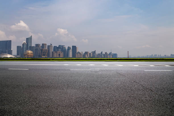 istock Panoramic skyline and modern business office buildings with empty road,empty concrete square floor 973016970