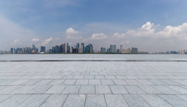istock Panoramic skyline and modern business office buildings with empty road,empty concrete square floor 973017118
