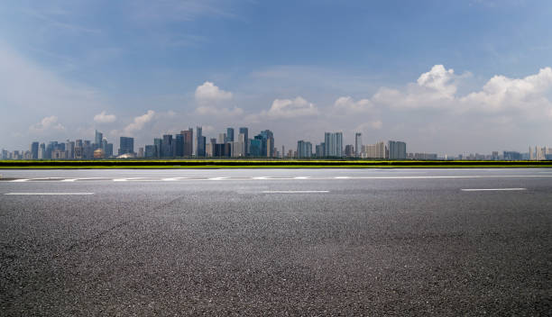 istock Panoramic skyline and modern business office buildings with empty road,empty concrete square floor 973017142