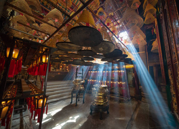 istock Light beams and incense smoke in Man Mo Temple, Hong Kong 973017206