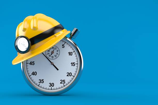 istock Miner helmet with stopwatch 973020148