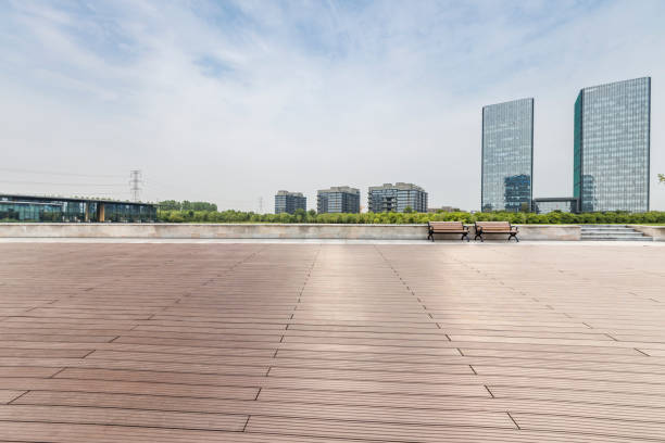 istock Panoramic skyline and modern business office buildings with empty road,empty concrete square floor 973025182