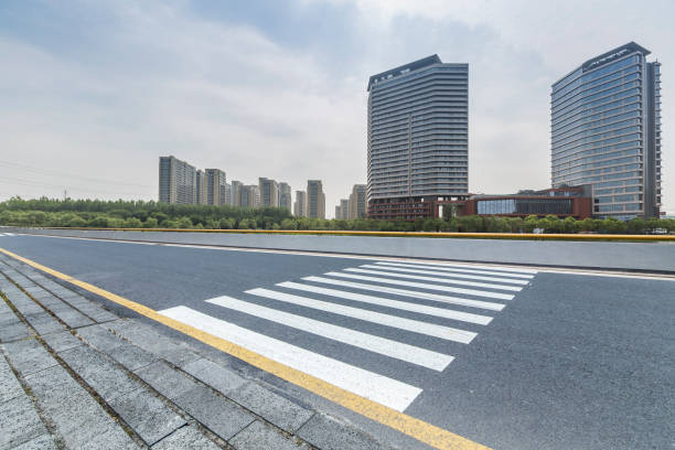 istock Panoramic skyline and modern business office buildings with empty road,empty concrete square floor 973025574
