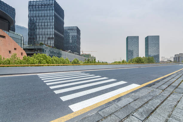 istock Panoramic skyline and modern business office buildings with empty road,empty concrete square floor 973035594