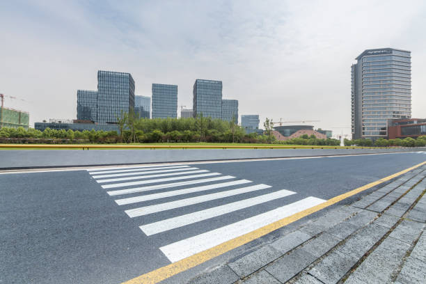istock Panoramic skyline and modern business office buildings with empty road,empty concrete square floor 973038602