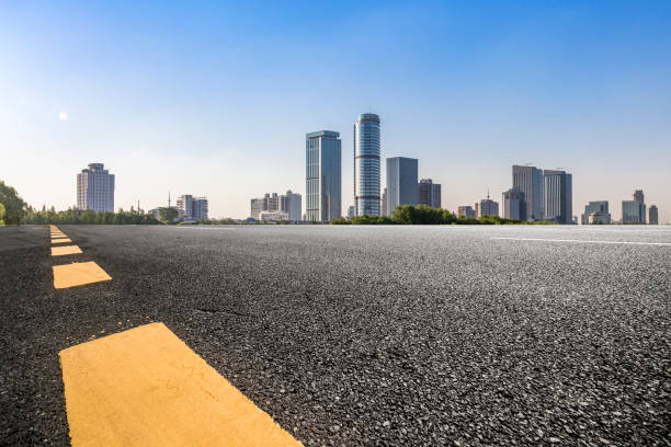 istock Panoramic skyline and modern business office buildings with empty road,empty concrete square floor 973050776