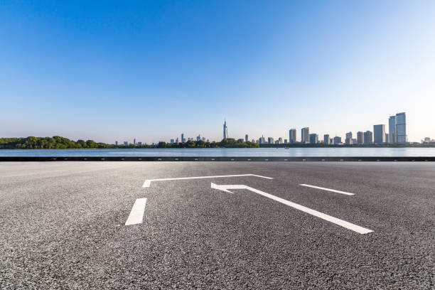 istock Panoramic skyline and modern business office buildings with empty road,empty concrete square floor 973053336