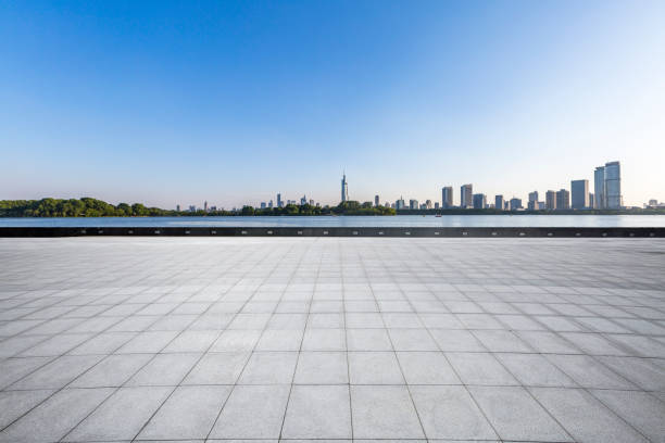 istock Panoramic skyline and modern business office buildings with empty road,empty concrete square floor 973053376