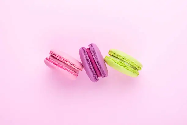 Photo of Three colorful macarons.