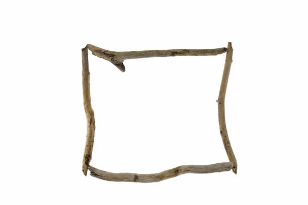 istock Driftwood frame. square frame of thin snags isolated on white background.Blank empty . top view, copy space 973062926
