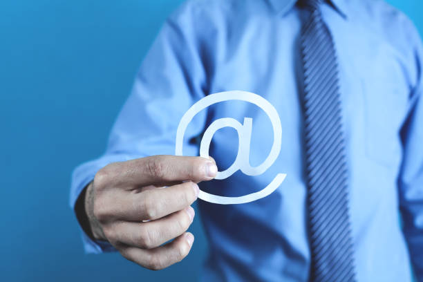 istock Businessman showing paper email symbol. 973069474