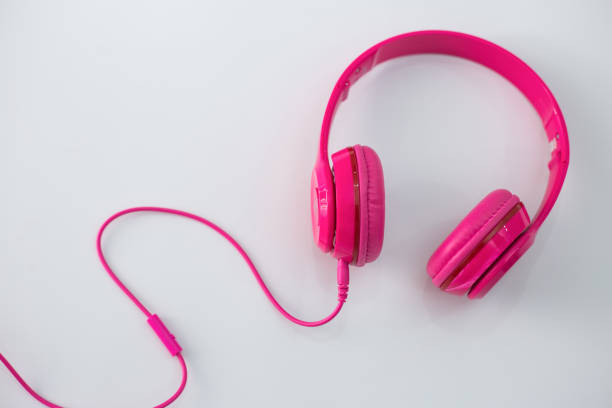 istock Pink headphones on a white background. 973070336