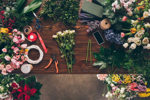 istock top view of white roses on florist table 973074604