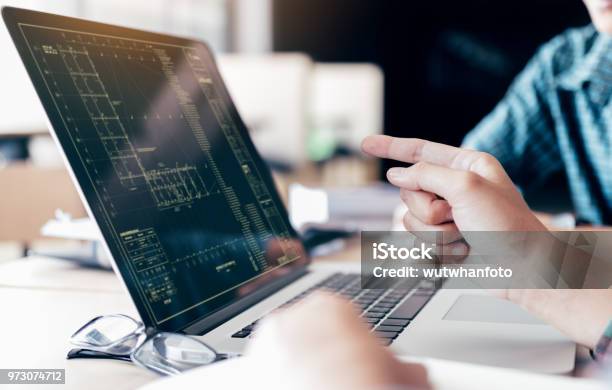Teenagers Develop Programming With Blueprint Code In Laptop Monitor Stock Photo - Download Image Now