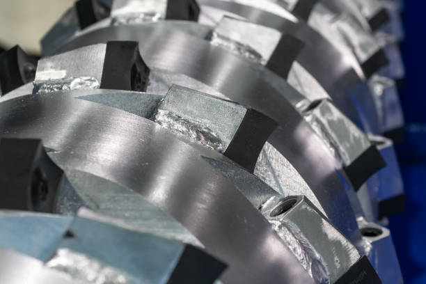 The main shaft of a mechanical industrial shredder The main shaft of a mechanical industrial shredder. Equipment for the processing of garbage. rusty cutter blade and teeth stock pictures, royalty-free photos & images