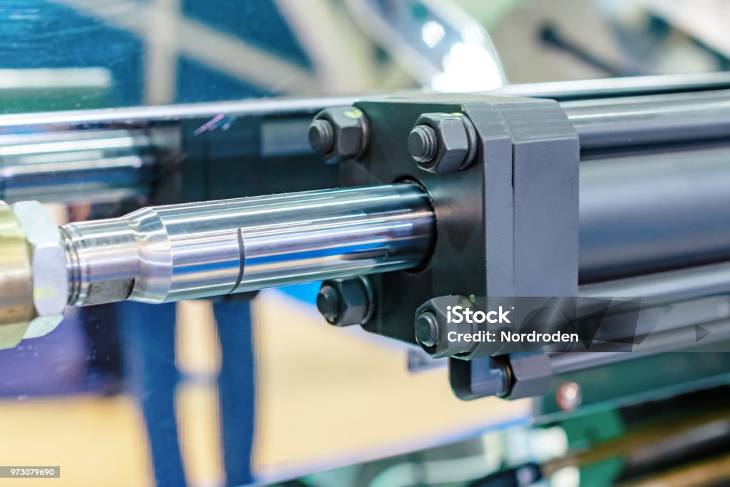 Hydraulic cylinder close-up Hydraulic cylinder close-up. The main force control element of the mechanisms. Hydraulics Stock Photo