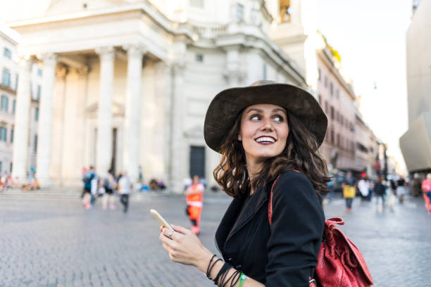 istock Beautiful tourist using smart phone outdoors 973082912