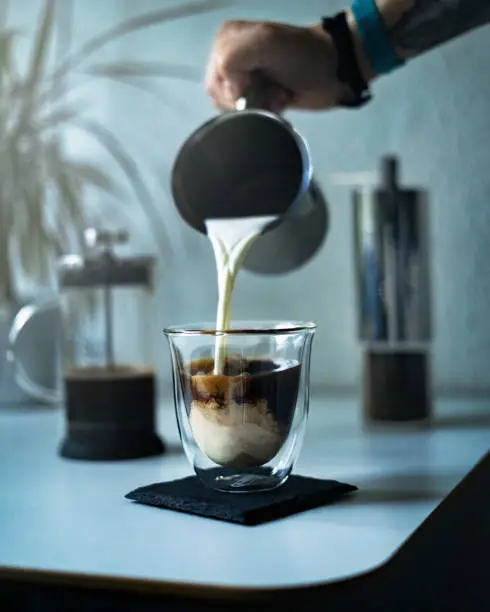 Delicious coffee in the morning with milk as a high-speed photo