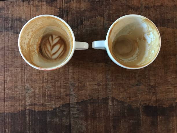 istock two cups of finished hot latte coffee 973086114