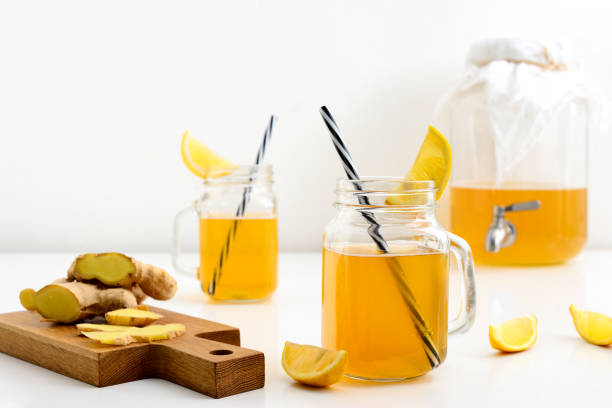 istock Ginger and lemon combucha detox drink in two jars 973089568