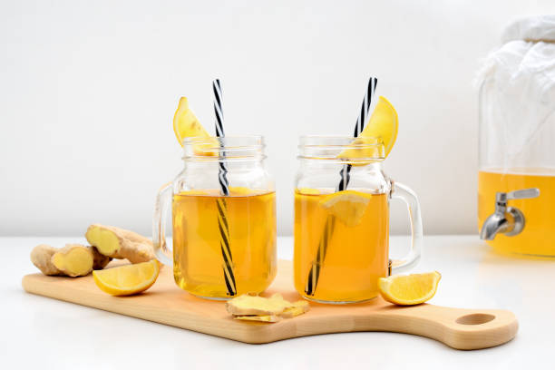 istock Ginger and lemon combucha detox drink in two jars 973089588