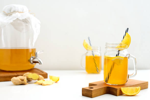 istock Ginger and lemon combucha detox drink in two jars 973089592
