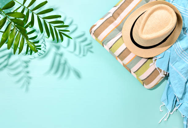 istock Sunny summer concept background with a strong shadow of palm leaf 973089610
