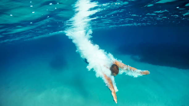 istock Man swimming in sea 973092592