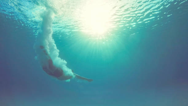 istock Man swimming in sea 973092604
