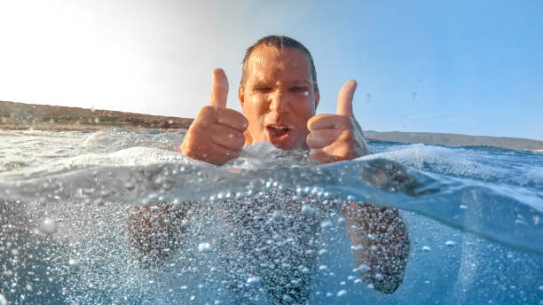 istock Man swimming in sea 973092606