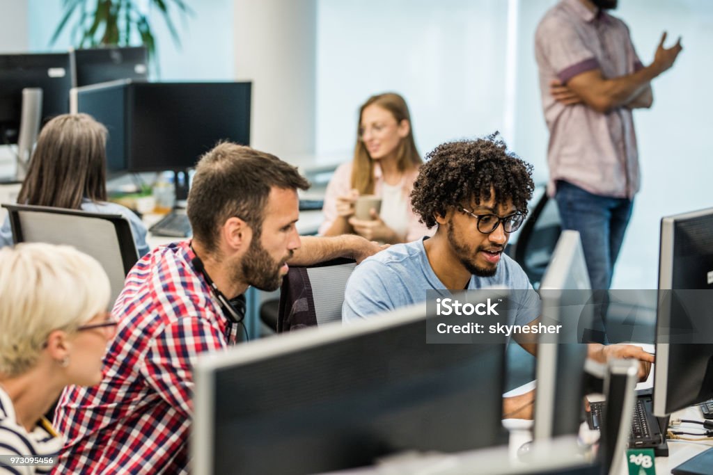 Computer Programmers Cooperating While Making New Software In The ...
