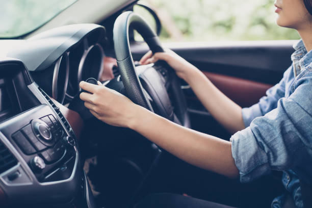 Asian Woman 's hands  Push button Turn Signal, button the car,selective focus on hand