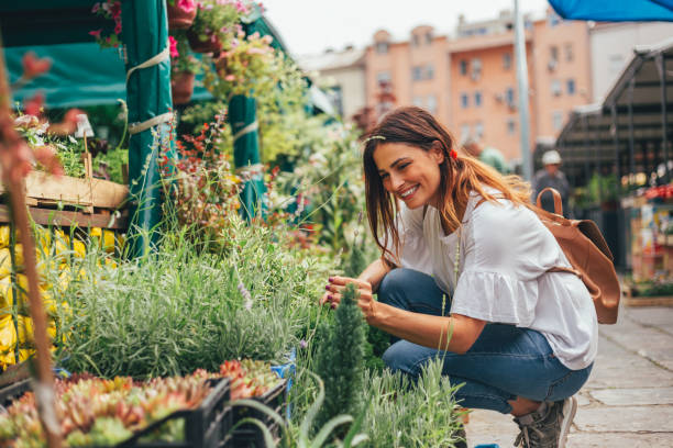istock Smiling women selected flowers 973099378