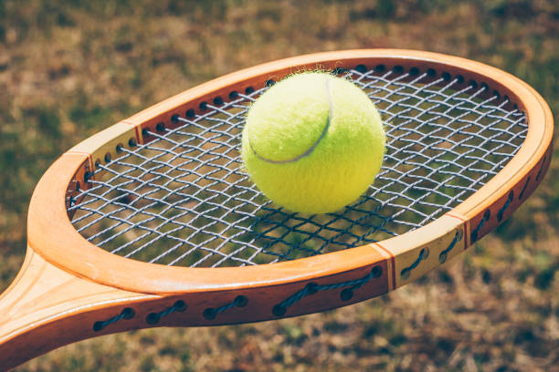 istock Tennis ball on racket 973104058