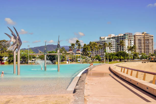 View of Cairns Esplanade Lagoon, a large public pool next to the beach. stock photo