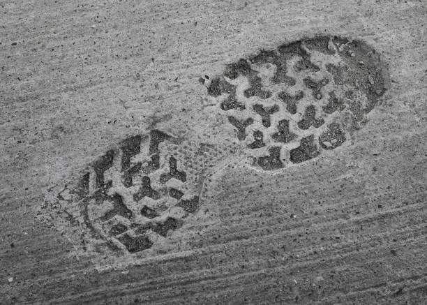 impression of shoe or boot in set concrete