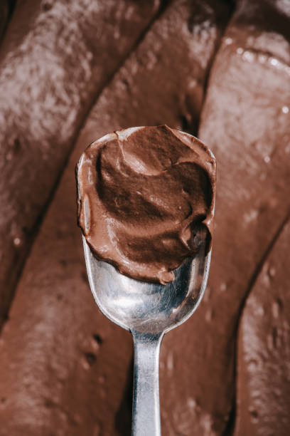 istock top view of spoon with tasty appetizing brown chocolate 973111600
