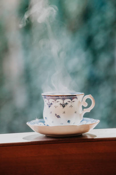 istock Elegant tea cup and stand shelf 973111742