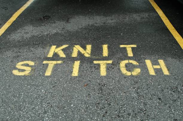 istock knit stitch parking text on tarmac 973111784