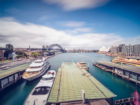 Sydney, NSW Australia - October 26th 2014: Panoramic drone aerial view over Opera House and Circular Quay. Celebrity Solstice cruise ship is seen leaving the Sydney Harbour, Sydney Australia.