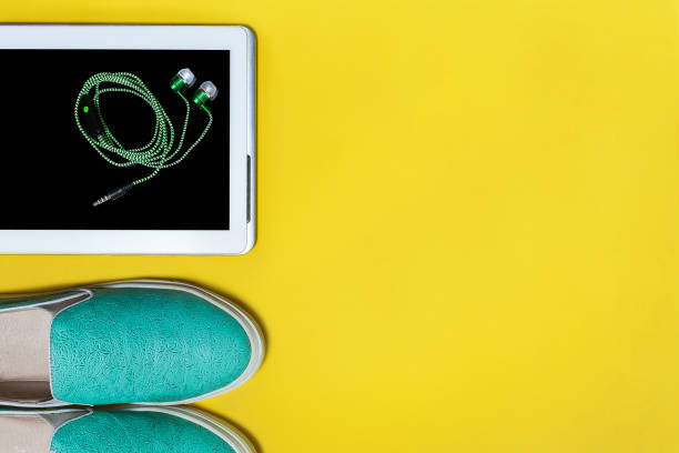istock shoes tablet and earphones 973116320