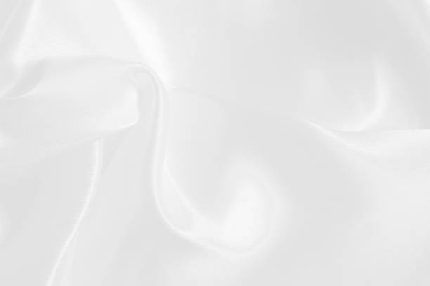 istock White fabric texture for background and design, beautiful pattern of silk or linen. 973116918