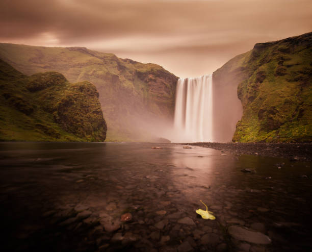 Below view of majestic Skogafoss waterfall in Iceland.