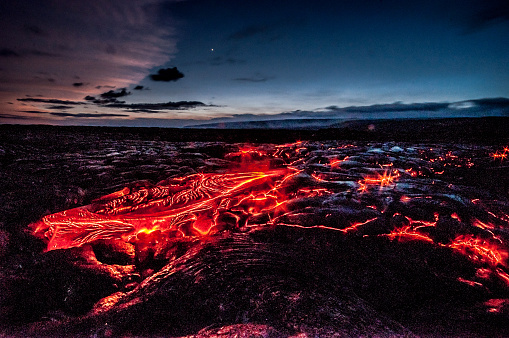 Red glowing lava flow from Kilauea volcano, Hawaii, USA