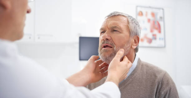 istock Doctor examining glands 973132740