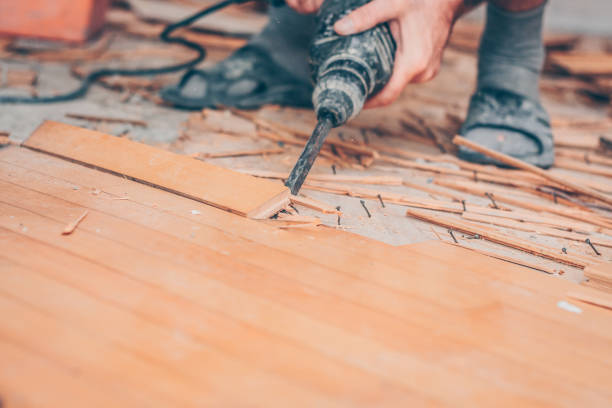 istock Working with a drill puncher breaks the parquet floor 973145470
