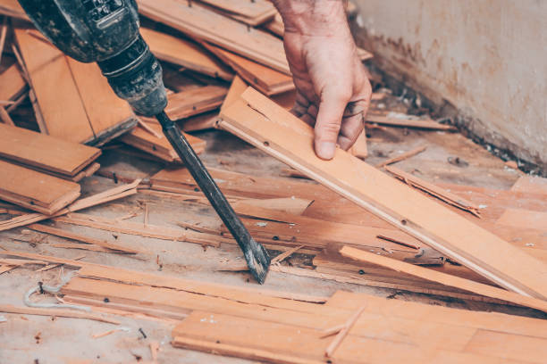 istock Working with a drill puncher breaks the parquet floor 973154040